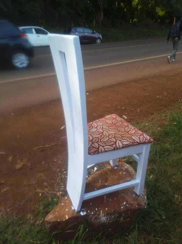 Shoe Rackhigh-backed wooden chair with a cushioned seat